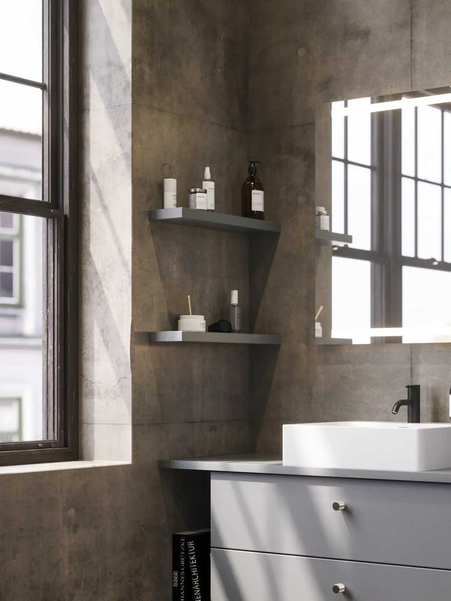 Badezimmer mit schrägen Wänden, grauem Waschtisch und Oberschrank, maßgefertigte Arbeitsplatten, modernes quadratisches Aufsatzwaschbecken, quadratischer Spiegel mit Beleuchtung, rohe Betonwände und -böden verleihen einen urbanen Ausdruck