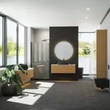 Minimalistische und stilvolle Badezimmer Inspiration mit Waschtischunterschrank, Unterschränken und Hochschränken aus goldener Eiche, großem rundem Spiegel mit Lichtsteuerung, farbigem WC und Aufsatzwaschbecken