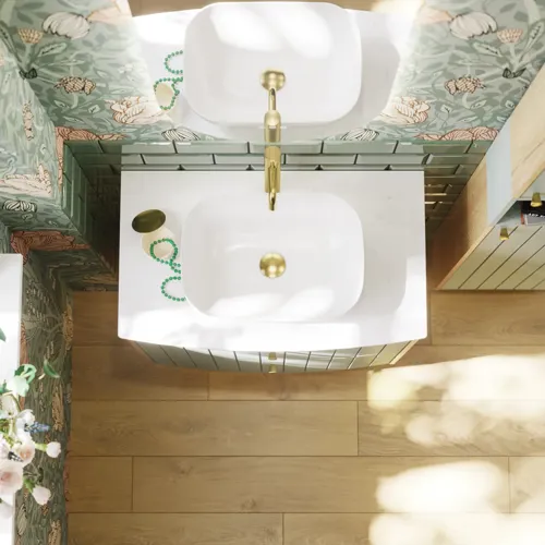 Badezimmerinspiration mit grünen Möbeln in Sonderfarbe mit Seiten aus naturbelassener Eiche, eleganten Rillen, stilvoller Arbeitsplatte mit ovalem Aufsatzwaschbecken, schönem ovalem Spiegel und Blumenmuster-Tapete für ein anmutiges, Retro-Aussehen.