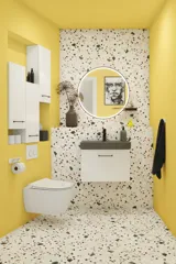 Kleine Badezimmerinspiration mit weißem Waschtisch mit schwarzem Griff und schwarzem elegantem Waschbecken, schönem rundem Spiegel mit schwarzem Rand, Terrazzo-Wand und -Boden und gelben Wänden für einen mutigen und modernen Look.