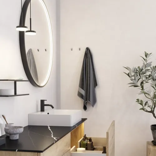 Großes urbanes Badezimmer mit Möbeln aus Eichenholz, Steinplatte mit quadratischem Becken, rundem Spiegel mit schwarzem Rand, Naturfarben und Terrakottaboden für einen industriellen und modernen Look